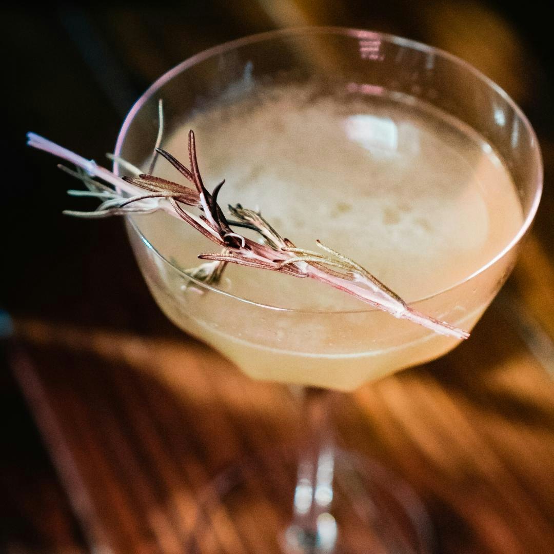 Cocktail with rosemary leaf