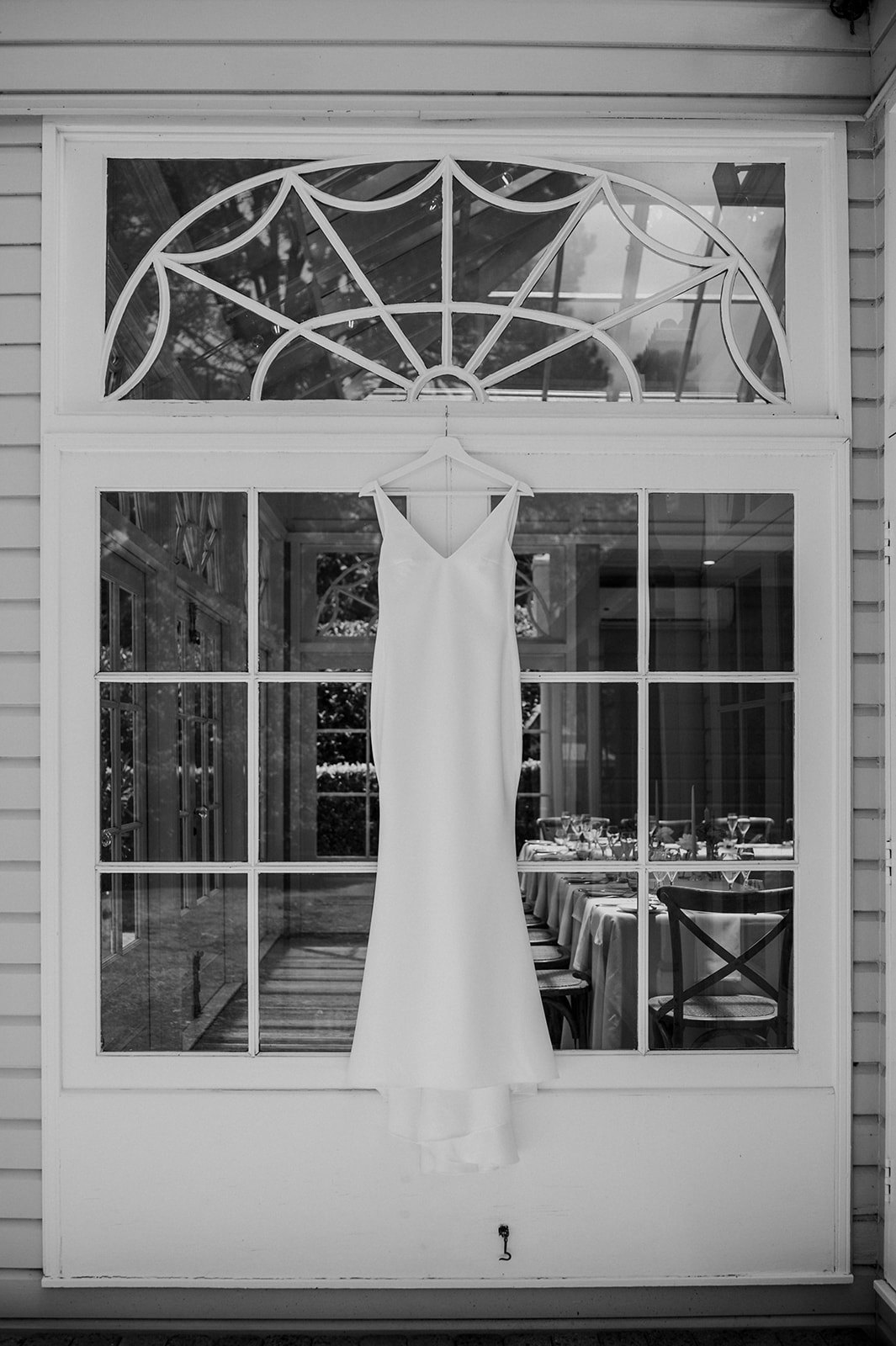 Wedding dress hanging on door