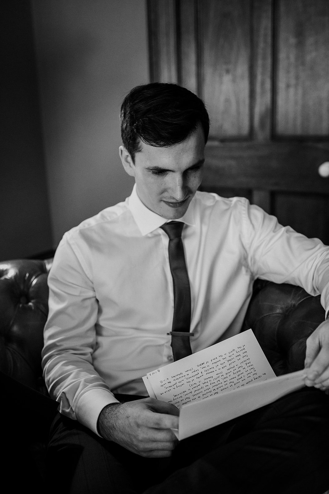 Groom reading a letter