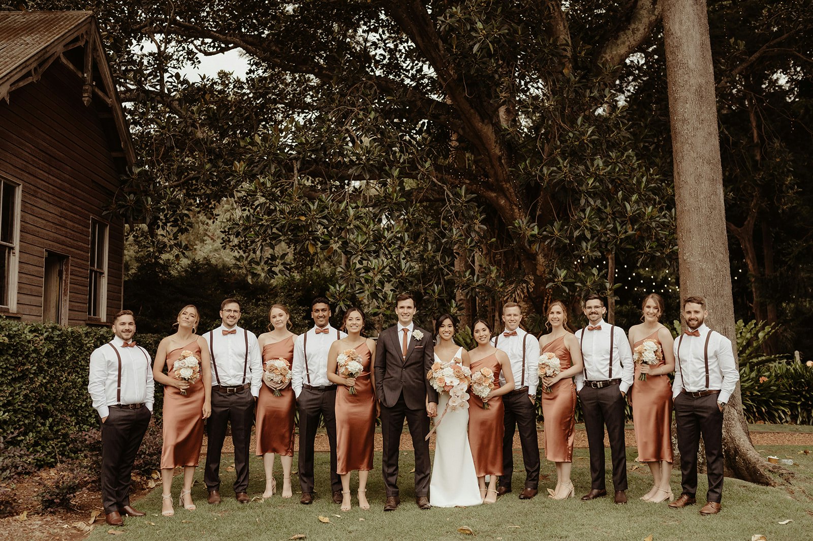 Wedding party in front of tree