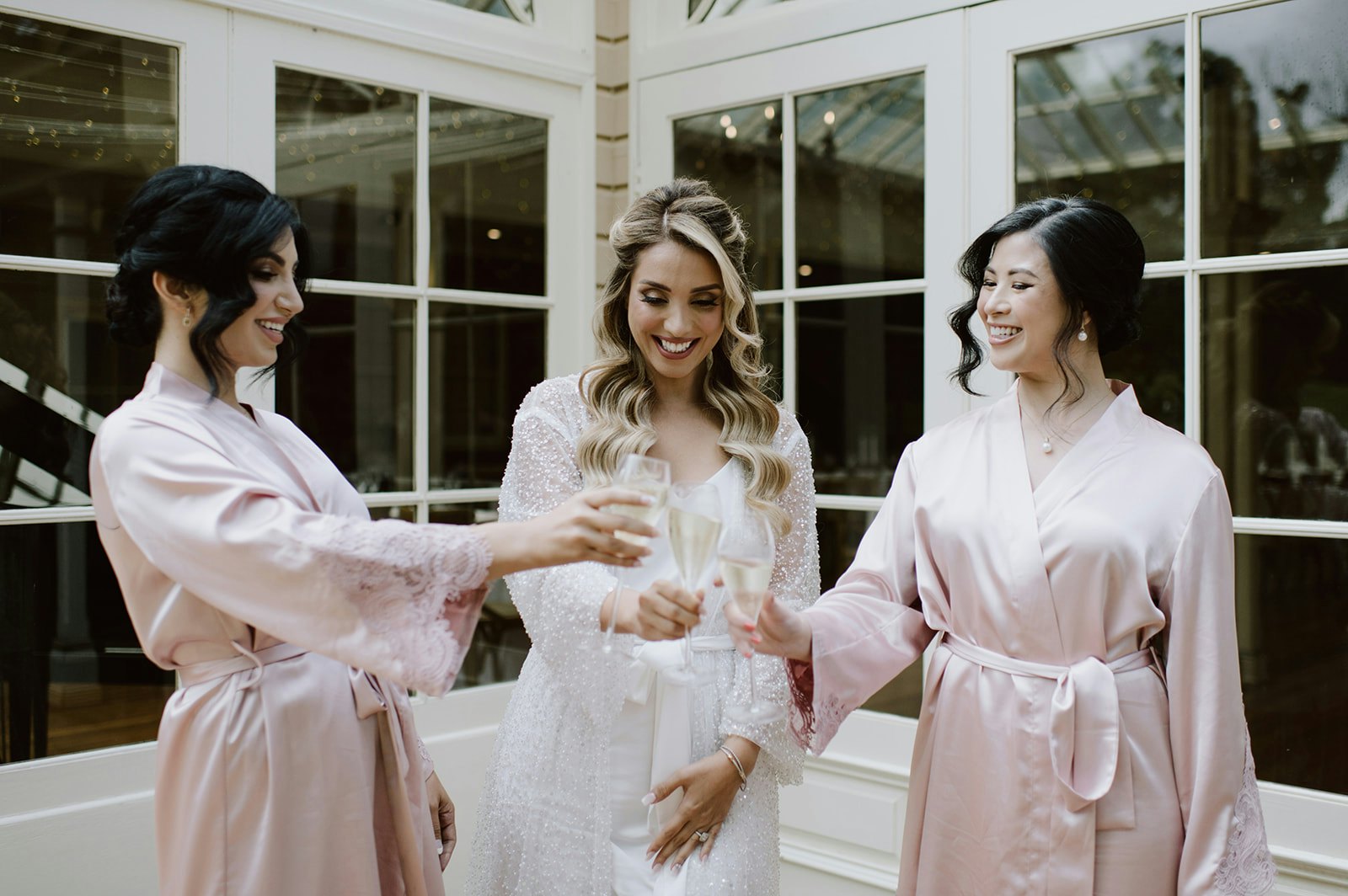 Bride and bridesmaids with champagne
