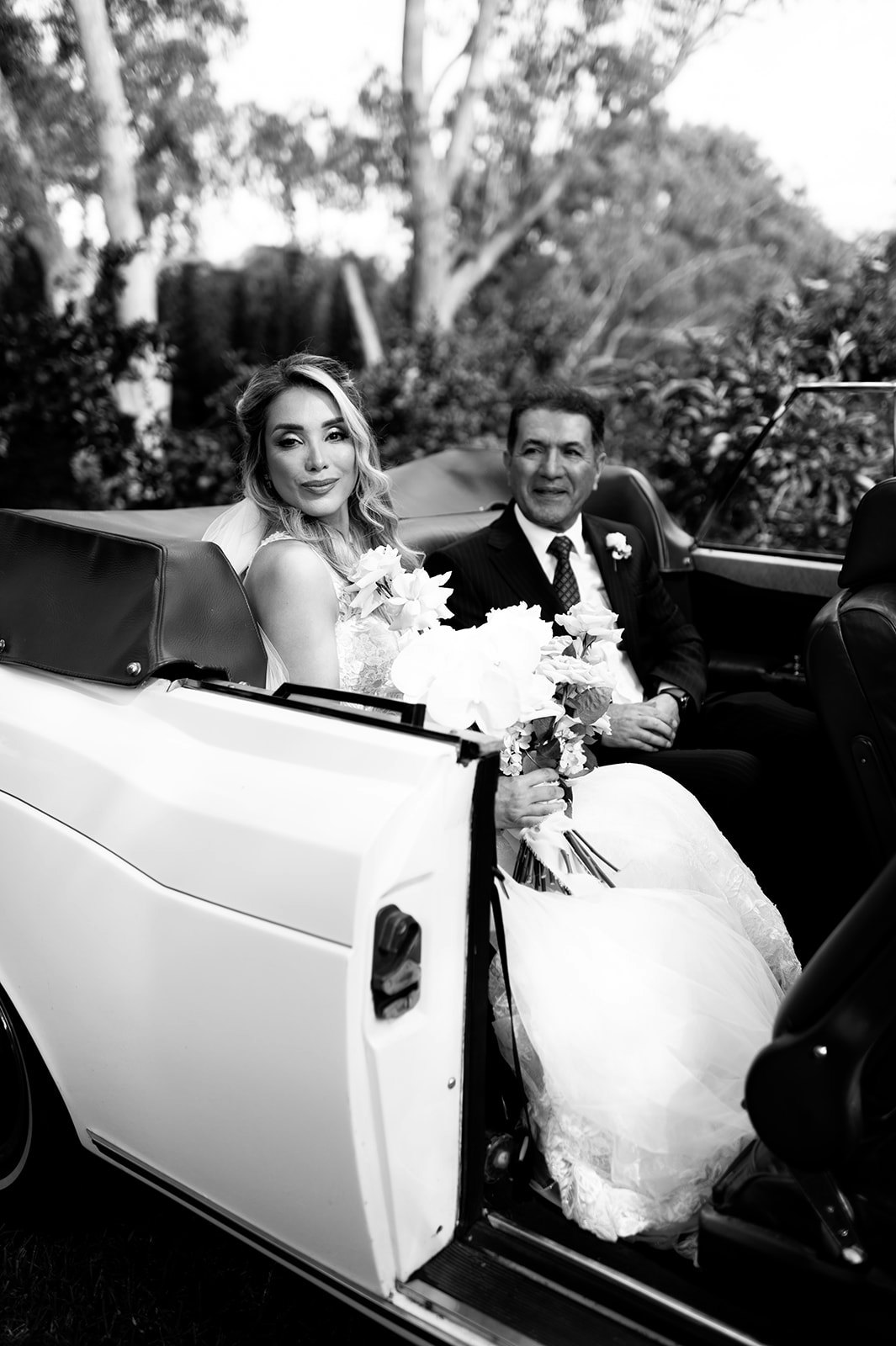 Bride and father arriving in car