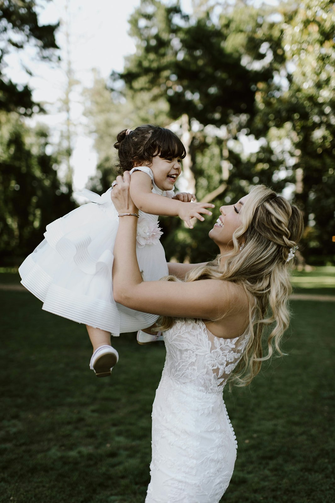 Bride and daughter dancing together