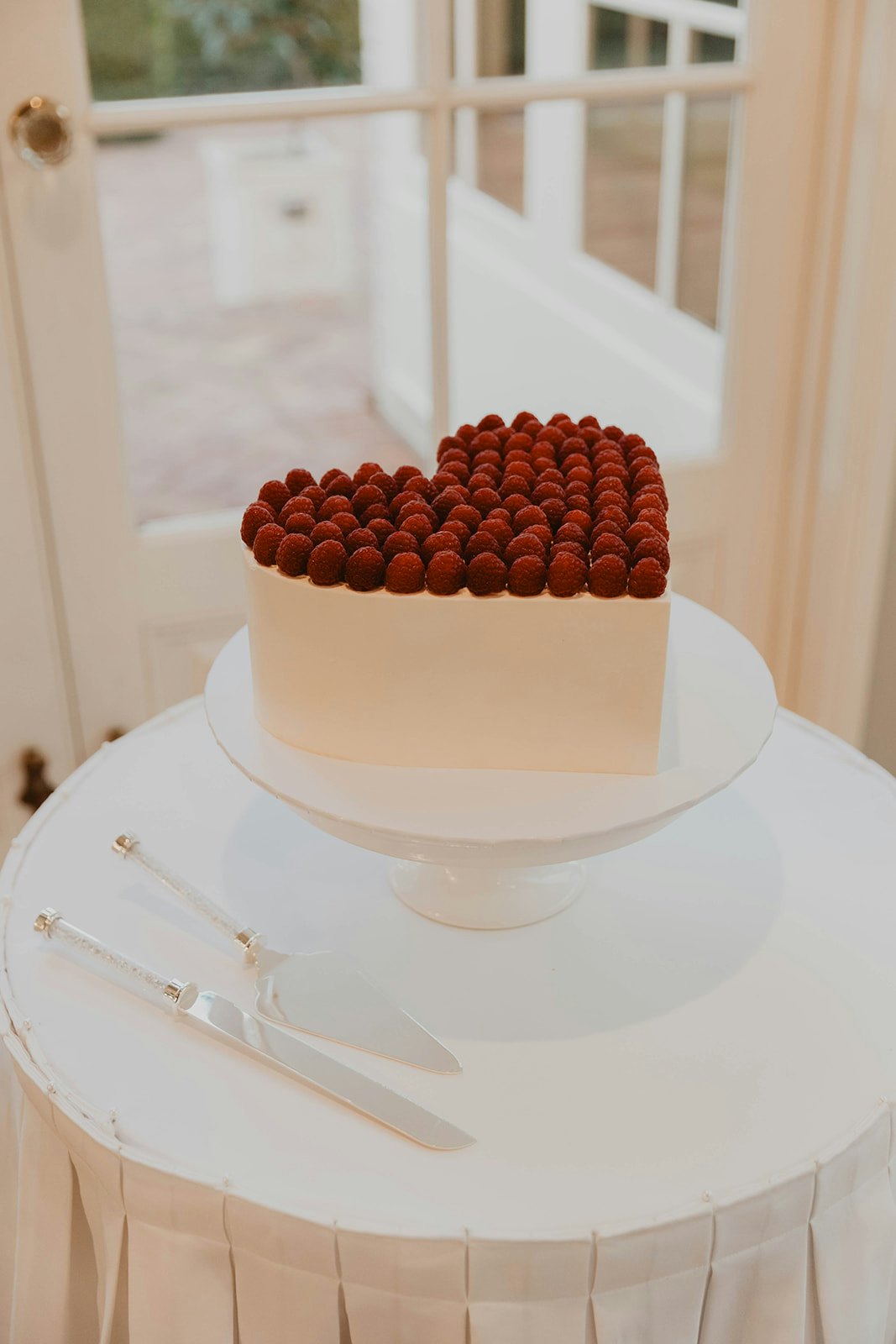 Wedding cake with raspberries on top