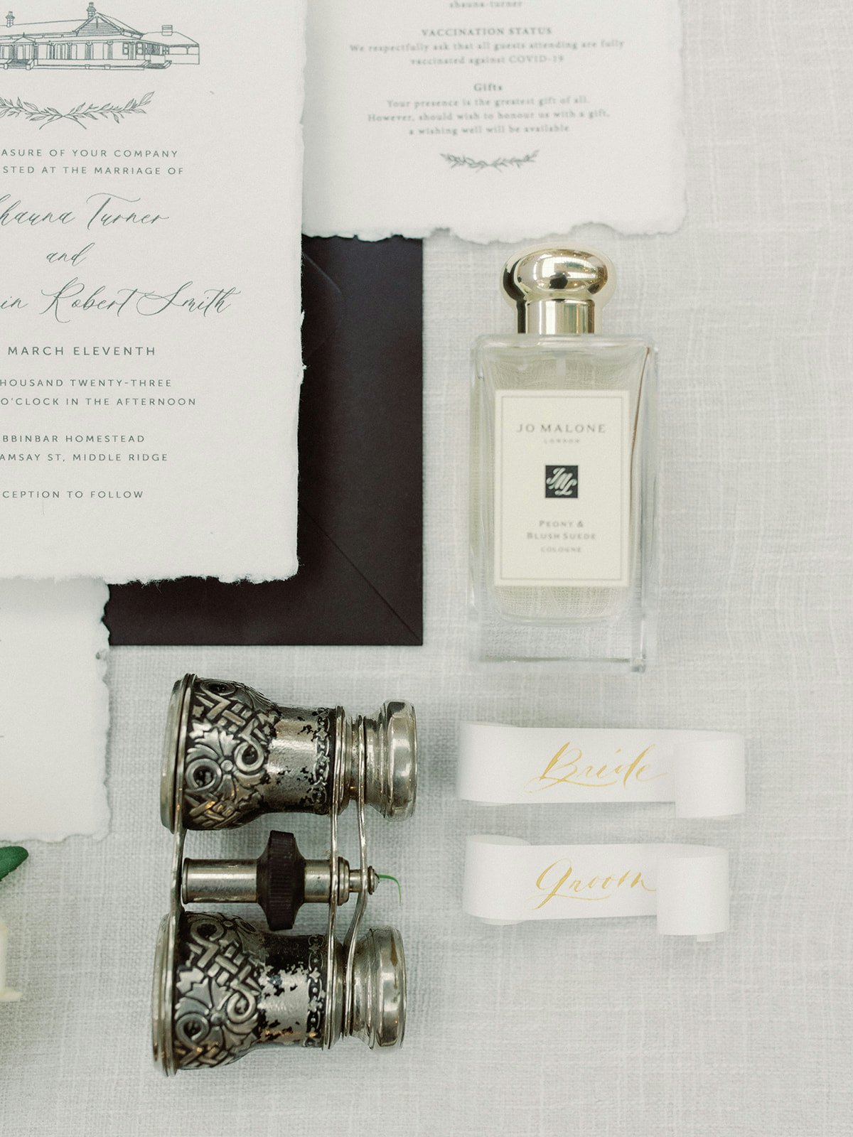 Perfume, binoculars and invitations