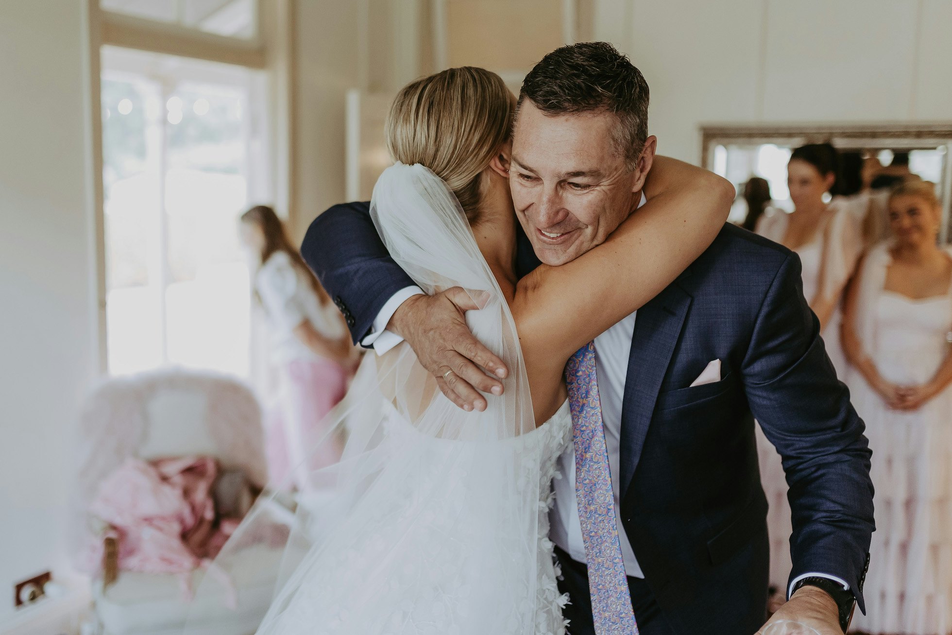 Bride hugging her father