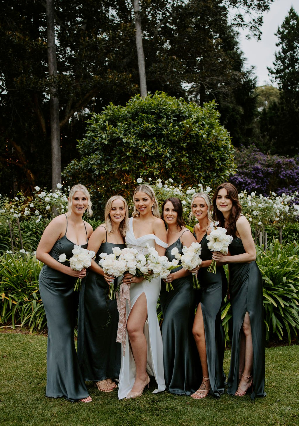 Bride and bridesmaids holding flowers