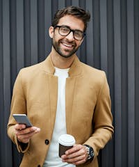 Handsome man in a beige coat