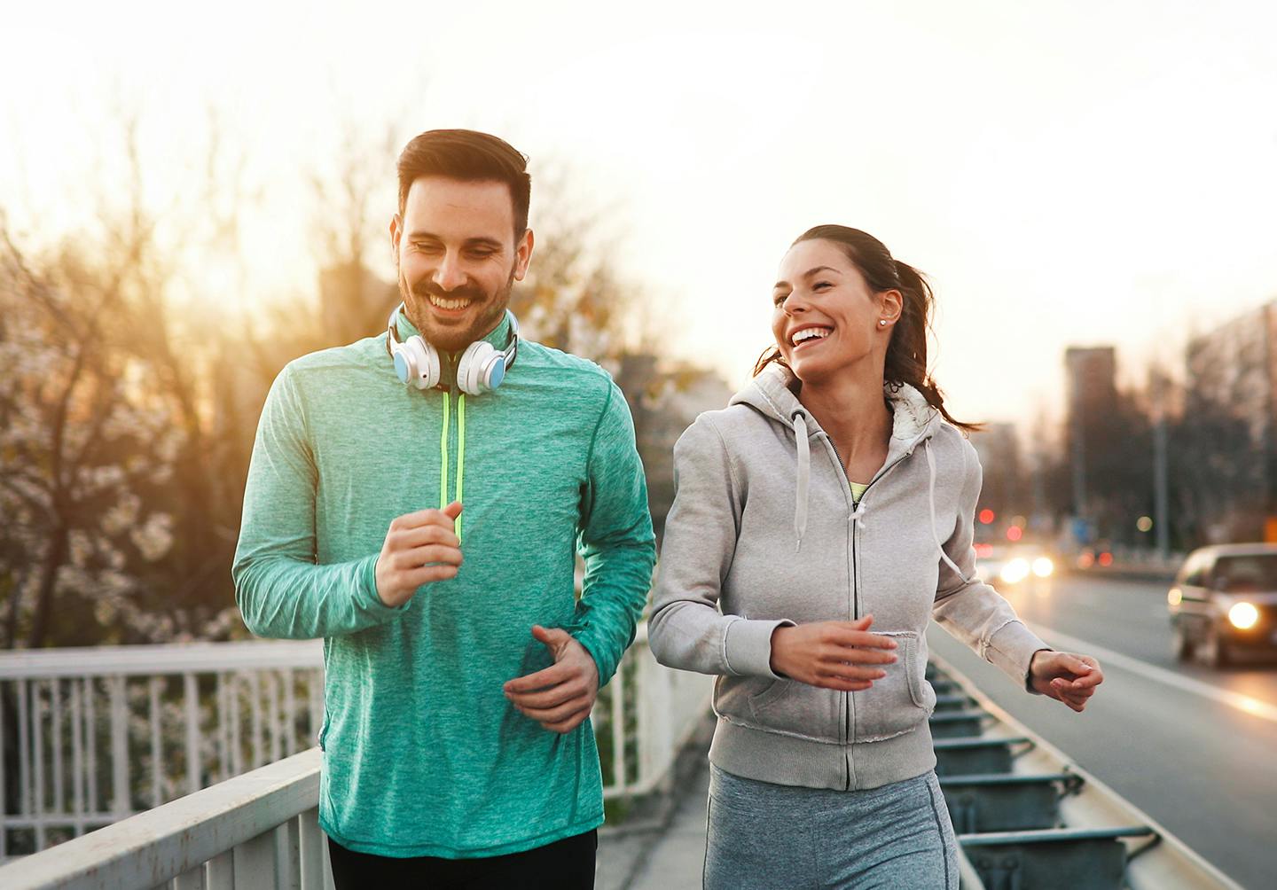 Couple running after joint pain treatment in Denver