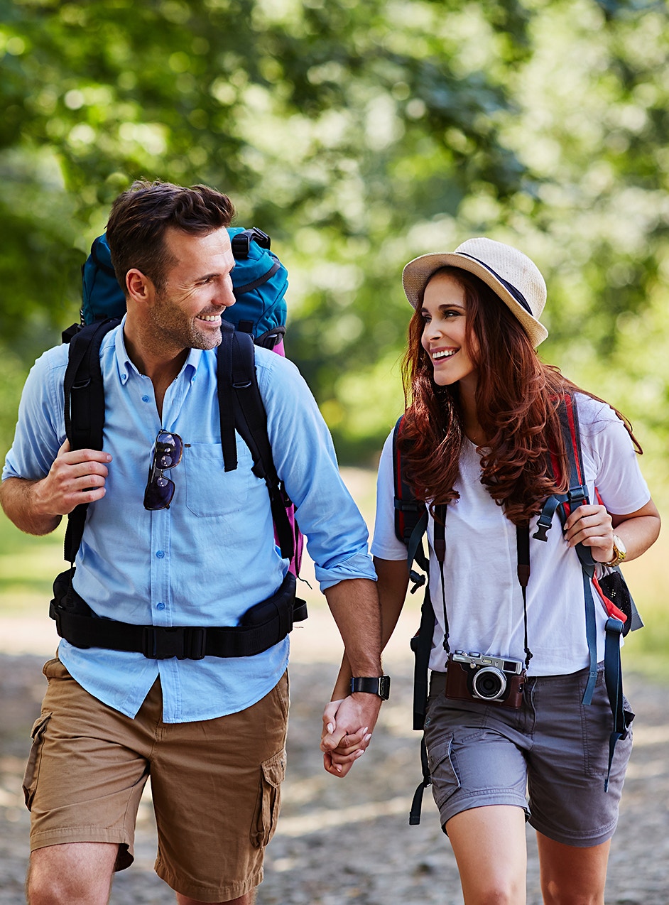 couple hiking and holding hands after hormone replacement therapy in Frederick, MD