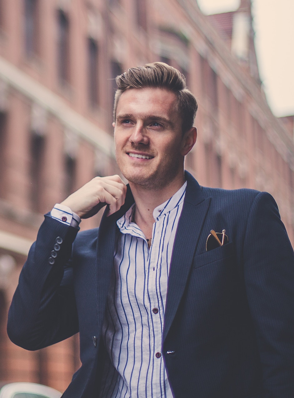 confident man in suit after hair restoration treatment in Omaha, NE