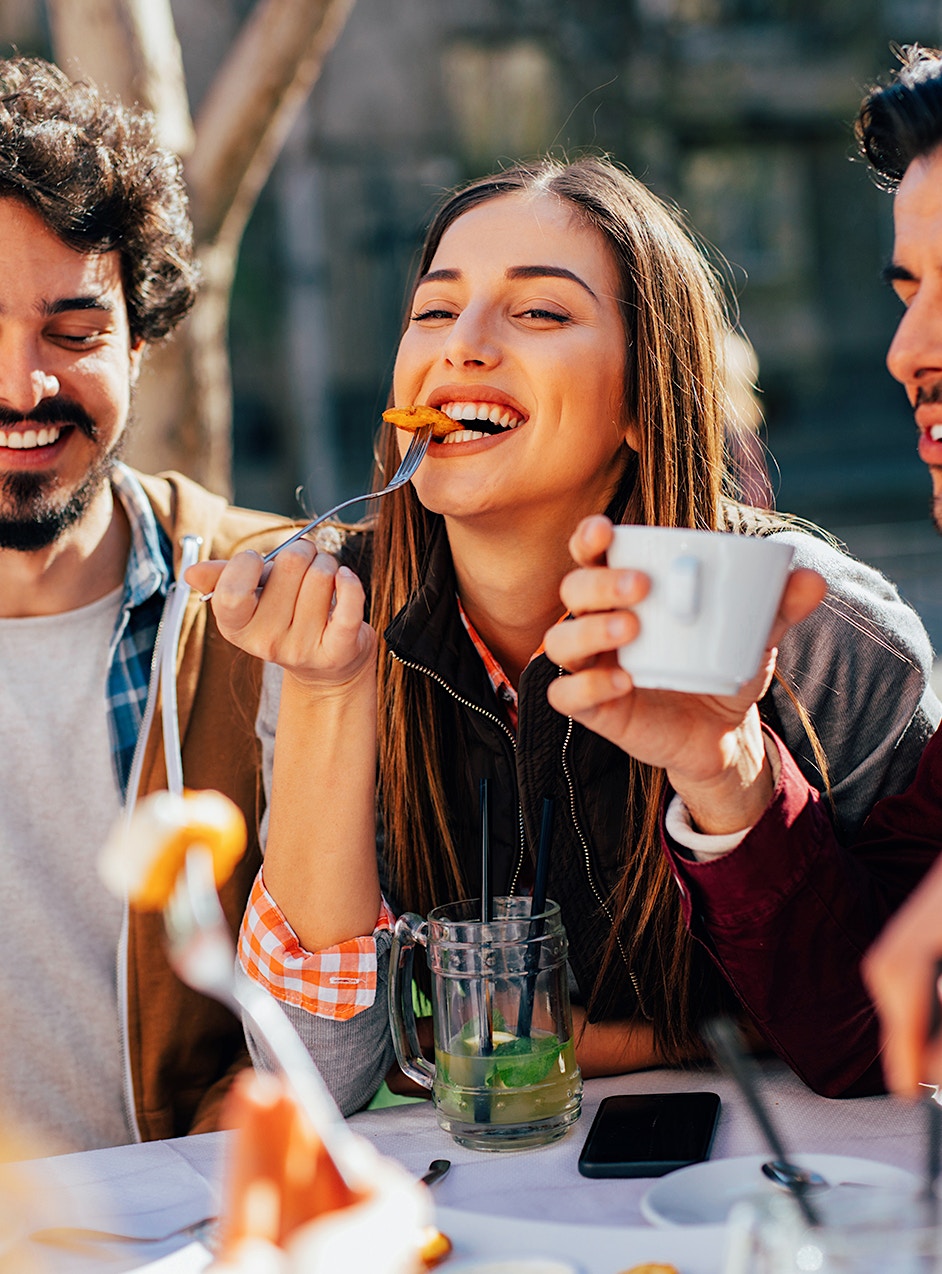 Happy woman eating after women's hormone therapy in Cumming