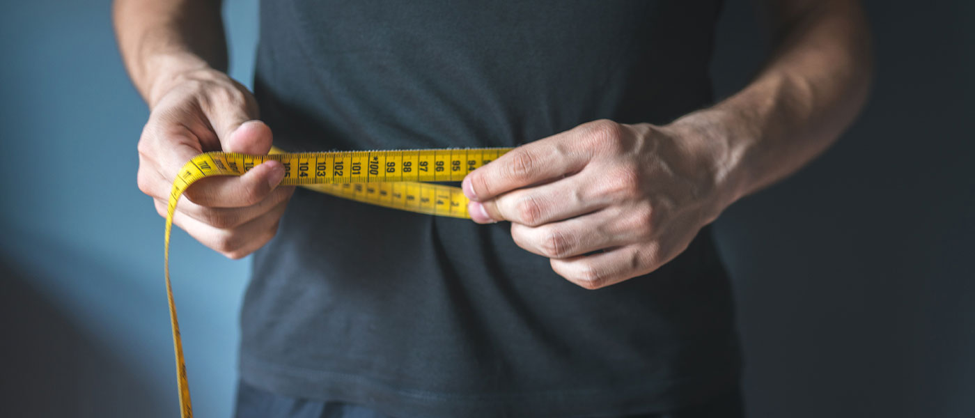 Man with measuring tape after taking semaglutide medicine