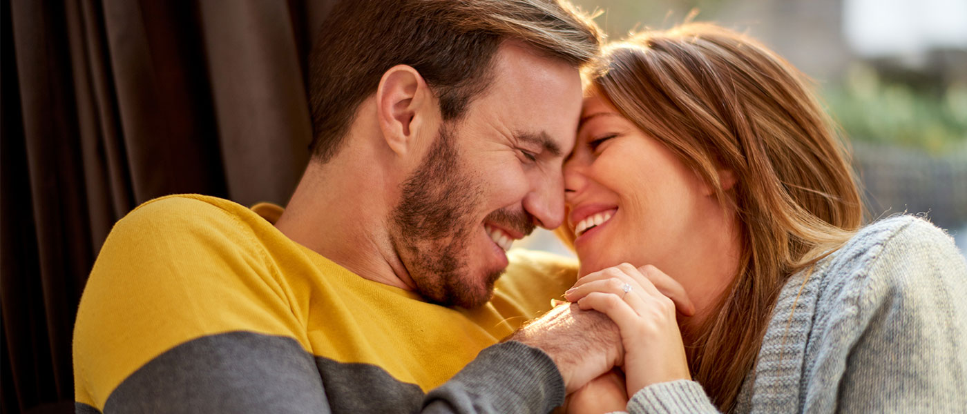 couple laughing after ED treatment from Genesis Lifestyle Medicine