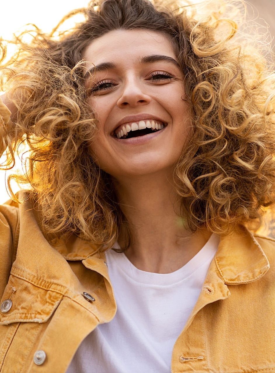 Smiling woman after Emface in Indianapolis, IN
