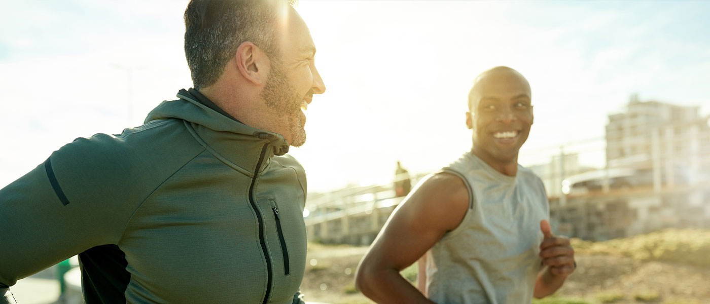 happy men running after TRT from Genesis Lifestyle Medicine