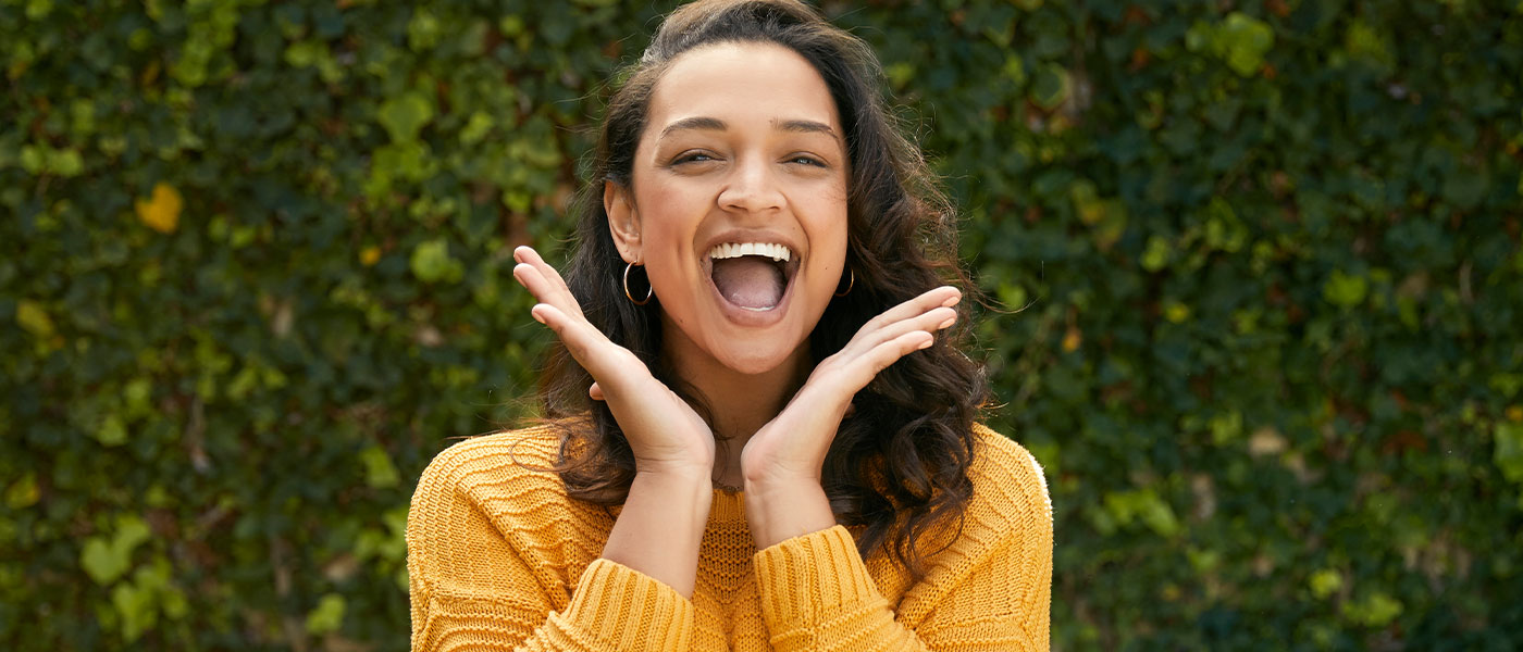 Smiling woman after CoolSculpting from Genesis Lifestyle Medicine.