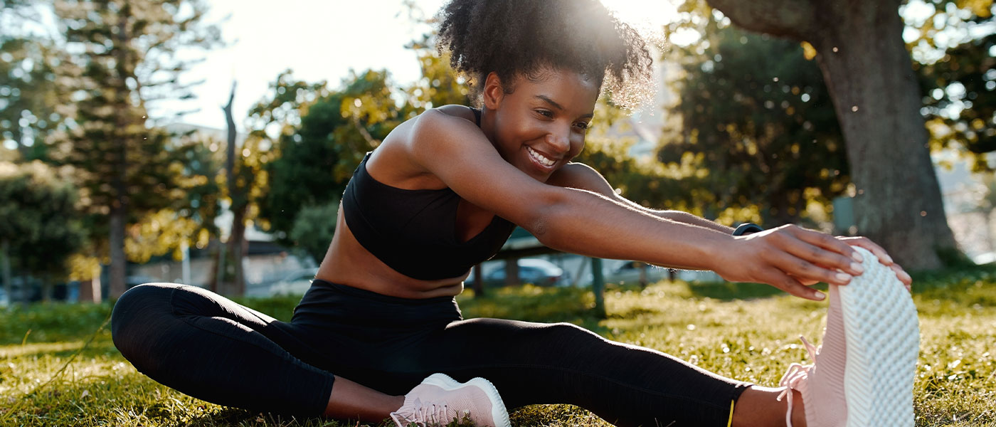 Woman exercising outside after weight loss program from Genesis Lifestyle Medicine.
