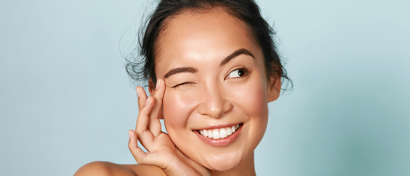 Woman with beautiful skin after receiving dermal filler from Genesis Lifestyle Medicine.