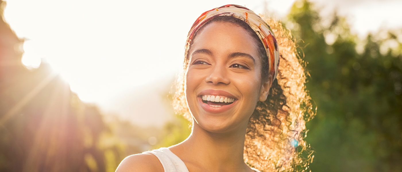 Happy woman outside after Botox from Genesis Lifestyle Medicine.