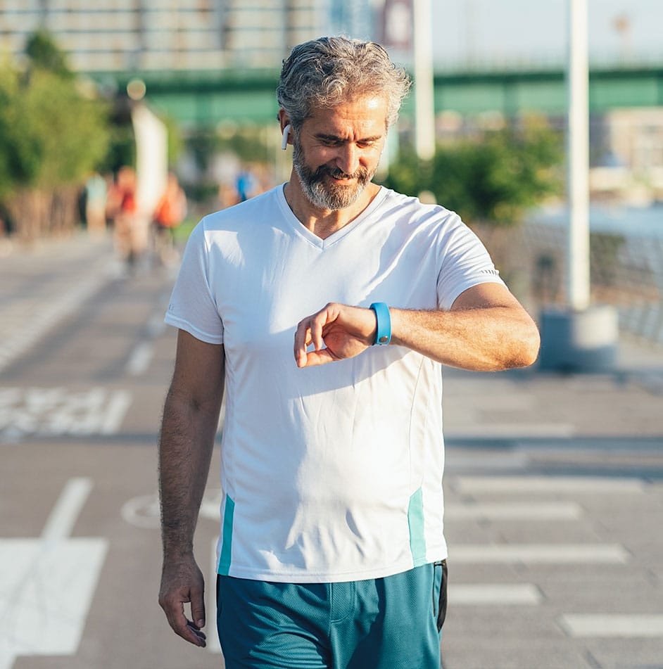 man looking at his watch after semaglutide in Greenwood, IN