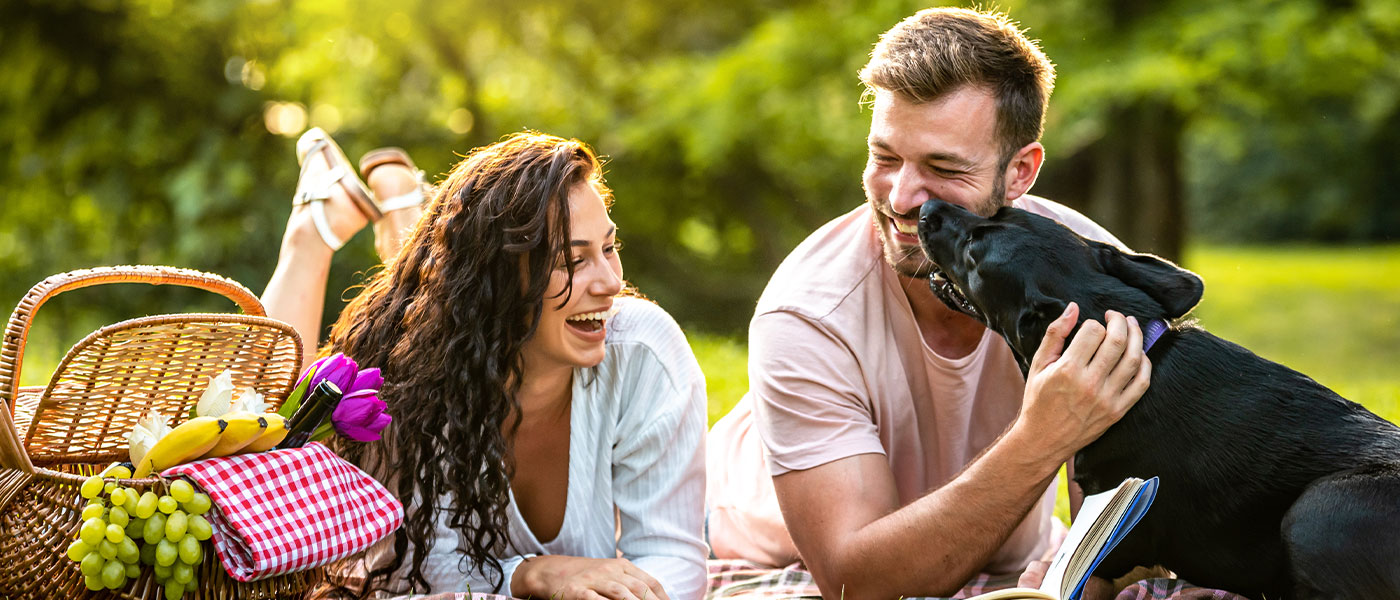 happy couple having a picnic after GAINSWave treatment from Genesis Lifestyle Medicine