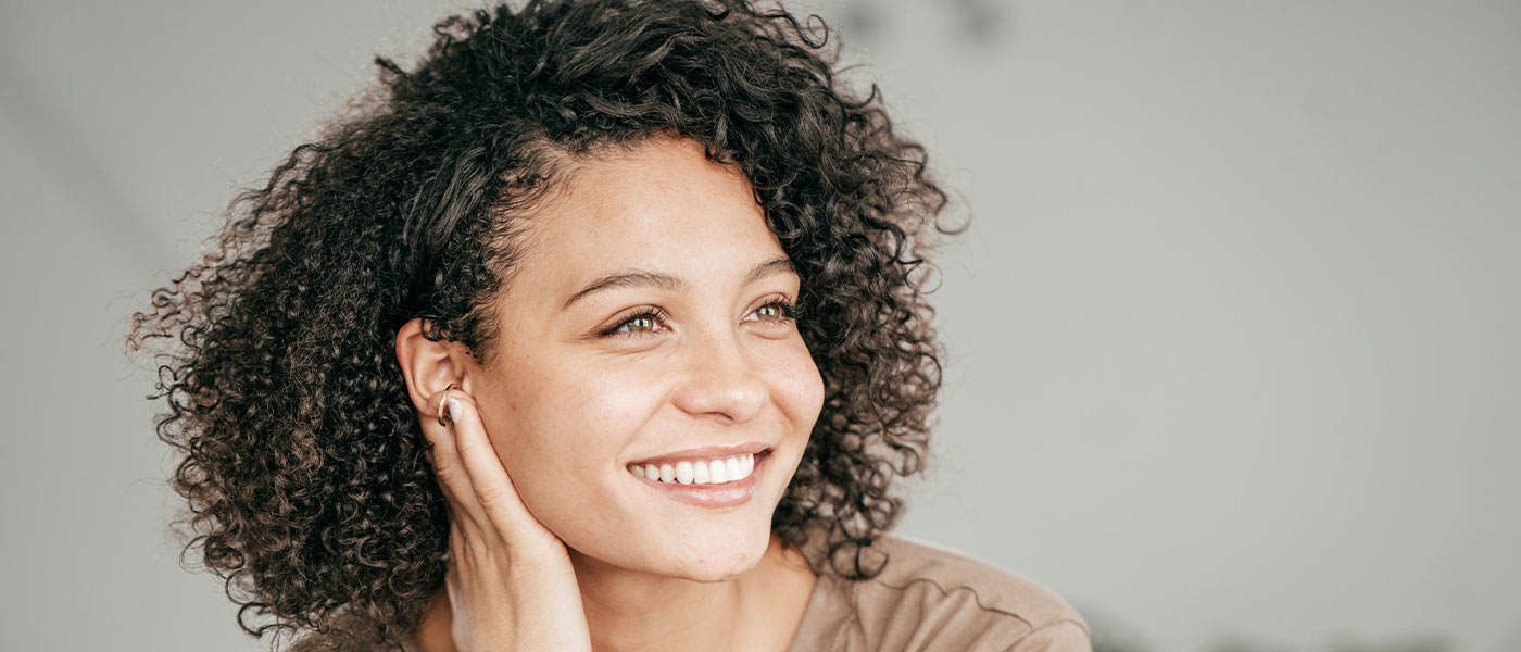 Woman with beautiful skin after CoolSculpting from Genesis Lifestyle Medicine.