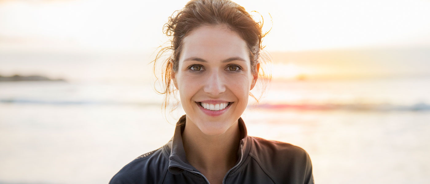 Happy woman after taking Tirzepatide from Genesis Lifestyle Medicine.