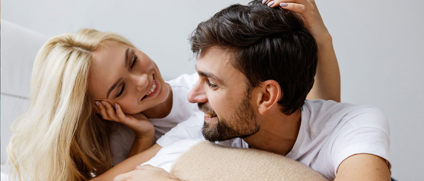 smiling couple after ED treatment from Genesis Lifestyle Medicine