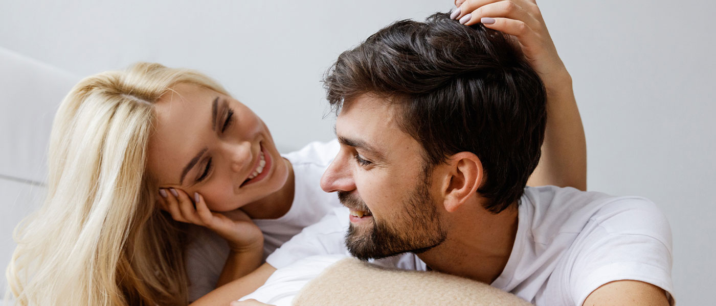 Smiling couple after P-Shot from Genesis Lifestyle Medicine.