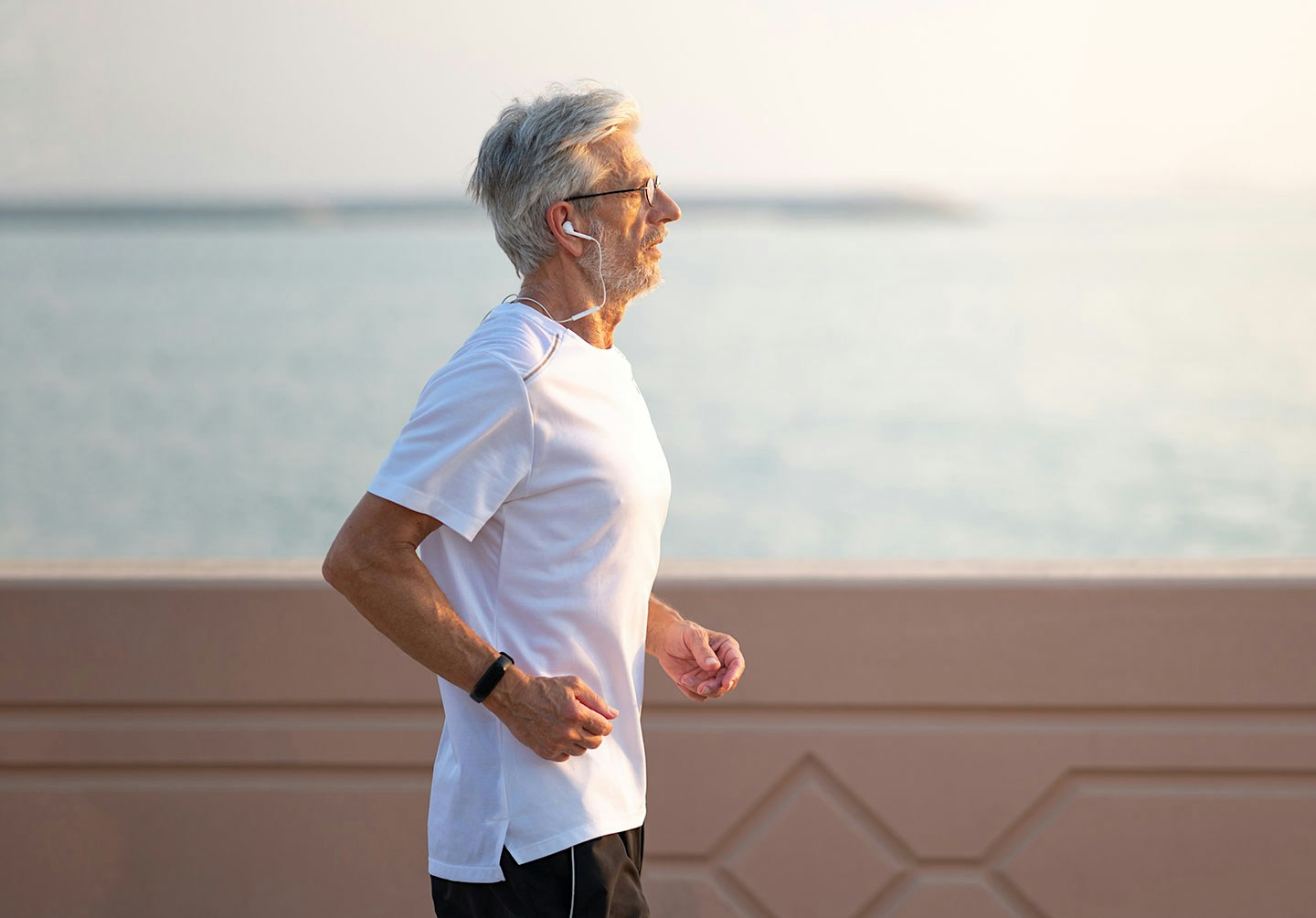 man jogging by the water after testosterone therapy in Sioux Falls
