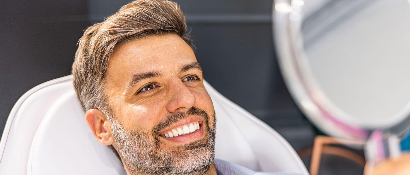 Happy man after receiving Botox at Genesis Lifestyle Medicine.