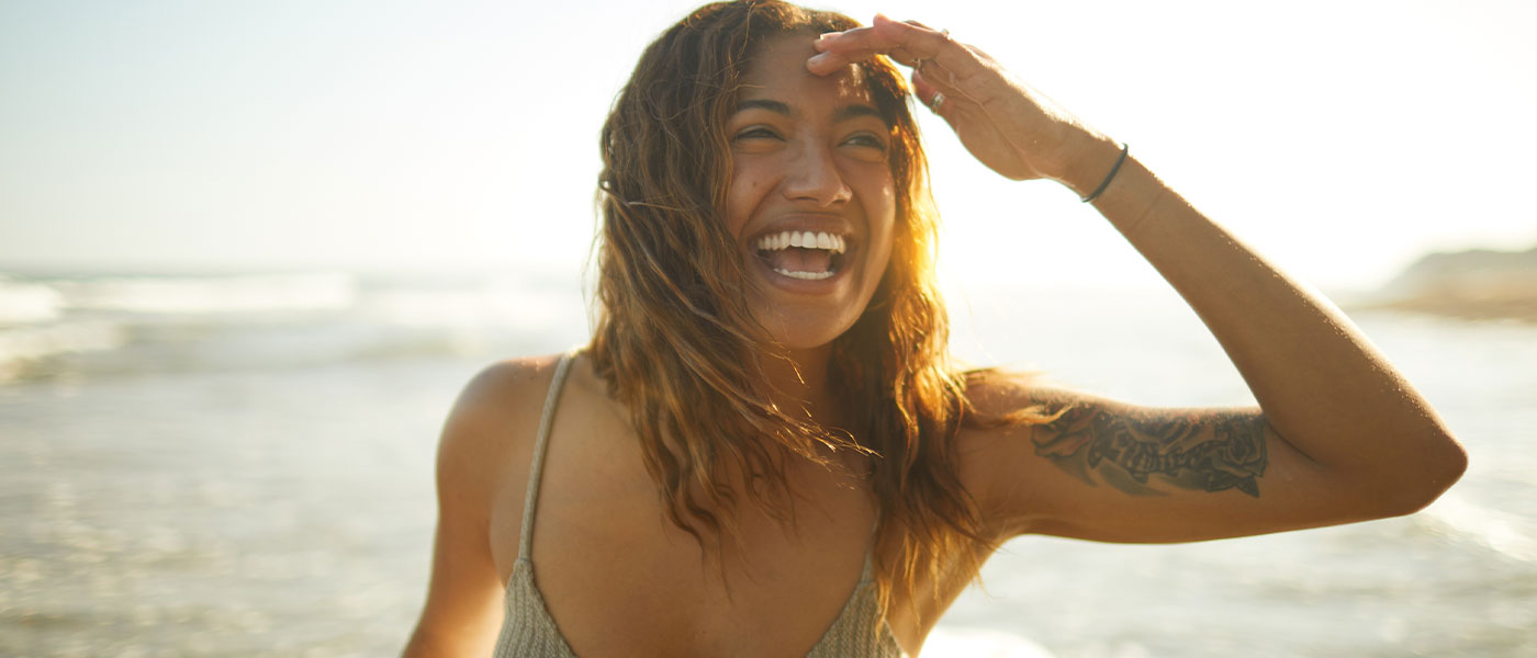 woman smiling after medical weight loss program from Genesis Lifestyle Medicine.