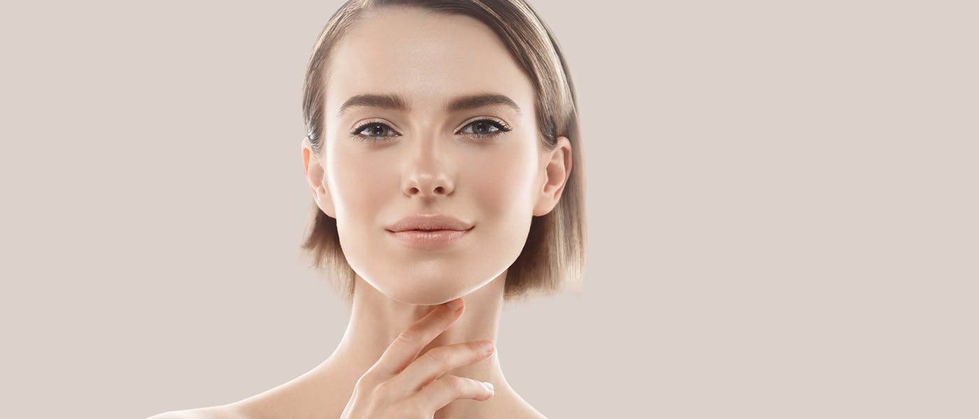 Woman with beautiful skin after receiving microneedling from Genesis Lifestyle Medicine.