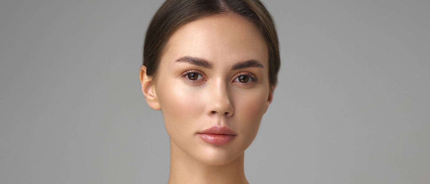 Woman with beautiful skin after dermal fillers from Genesis Lifestyle Medicine.