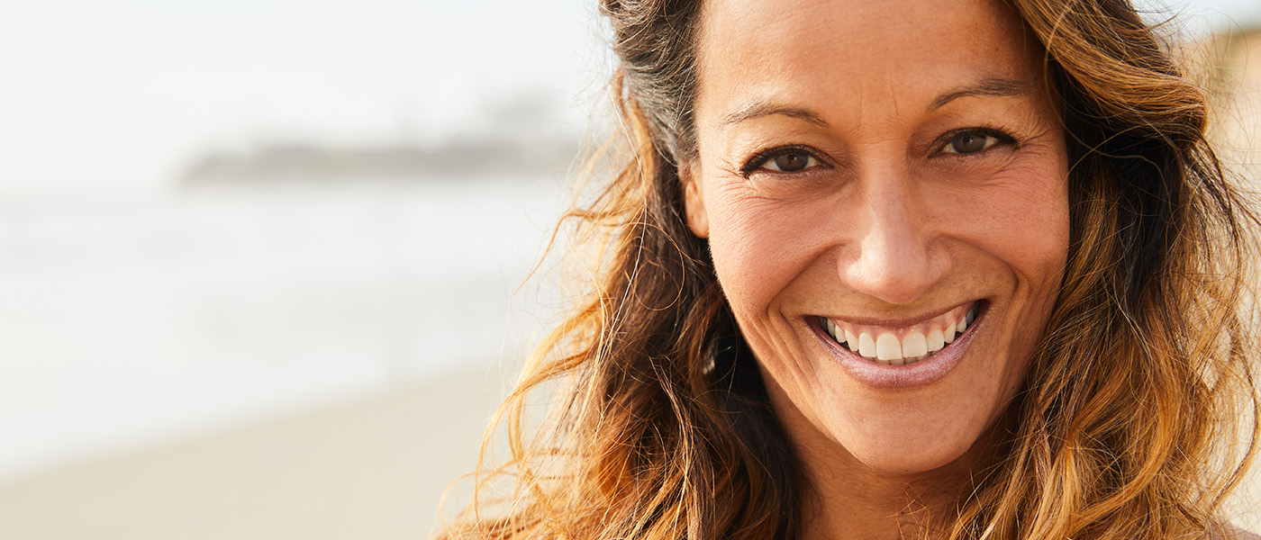 smiling woman after HRT for women in Los Angeles