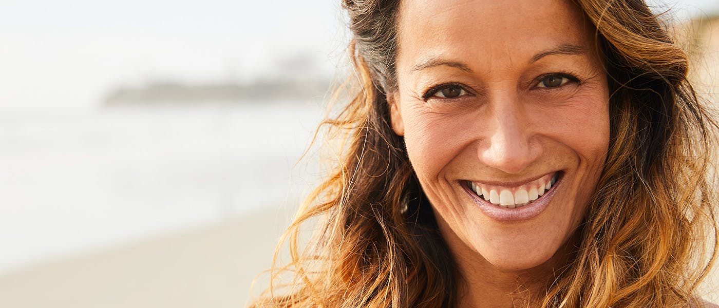 smiling woman after HRT for women in Los Angeles