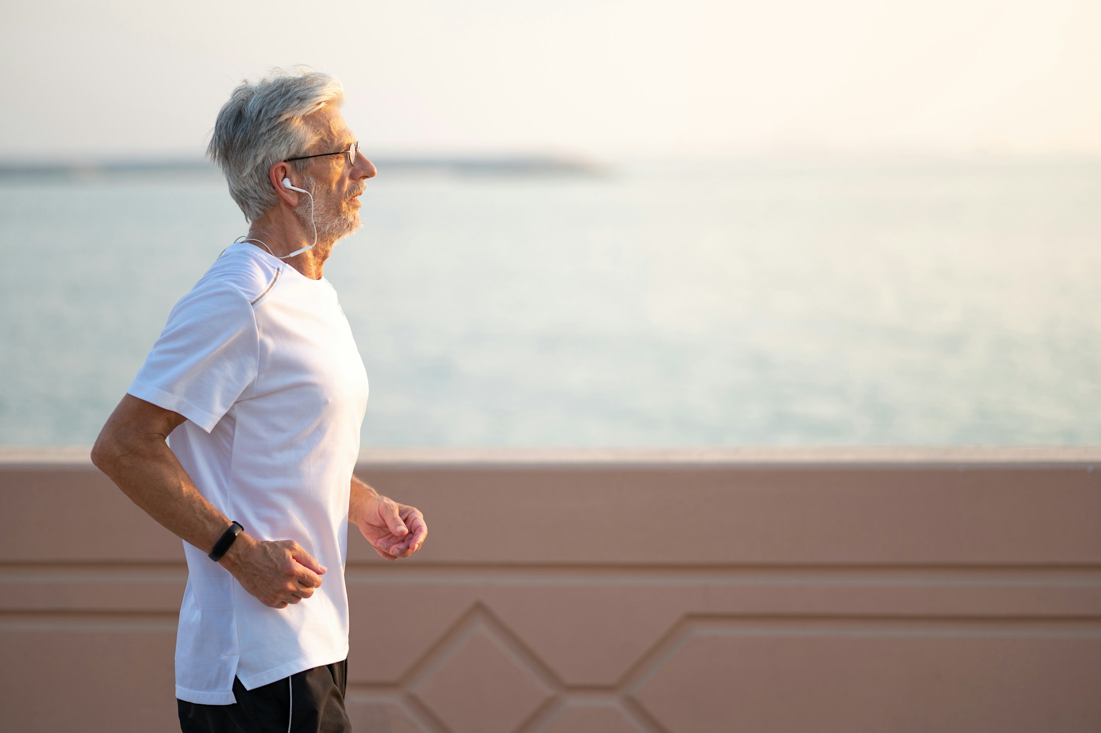Older man jogging after GLP-1 weight loss medication in Lakewood, CO