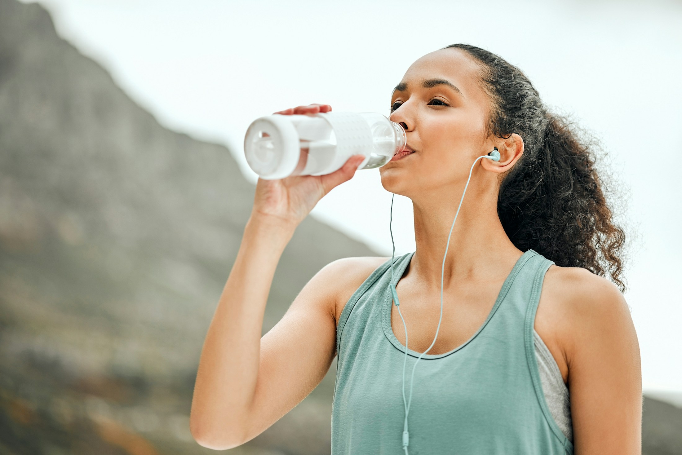woman drinking water after GLP-1 in Los Angeles