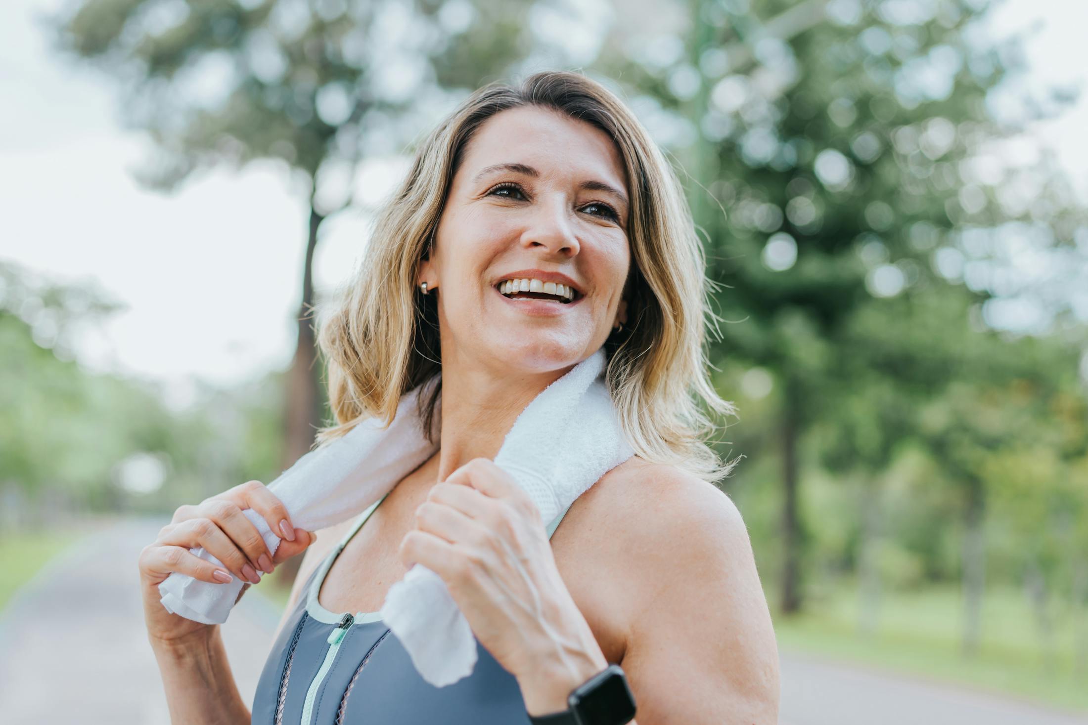 woman smiling after HRT for women in Costa Mesa