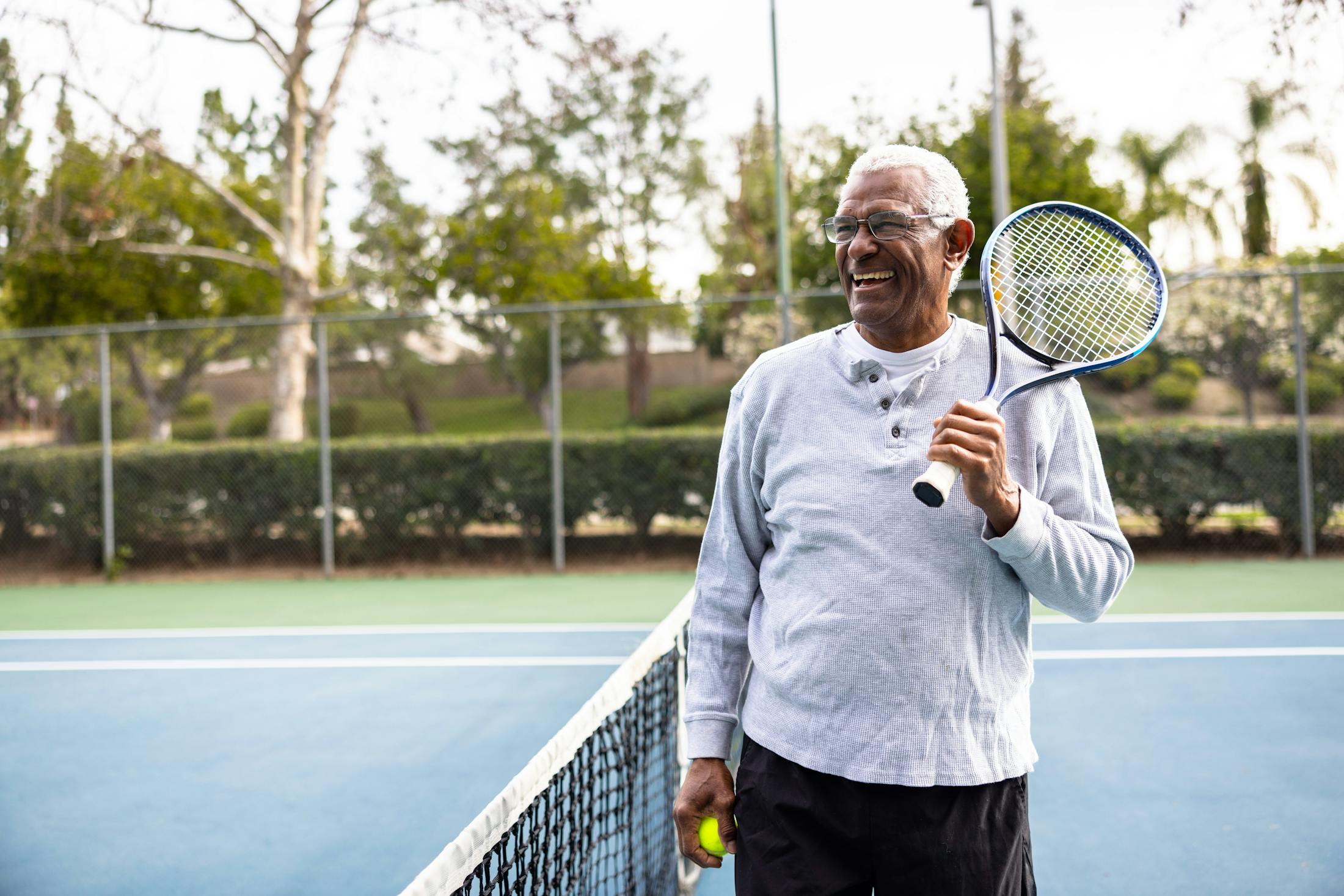 man playing tennis after testosterone therapy in Costa Mesa