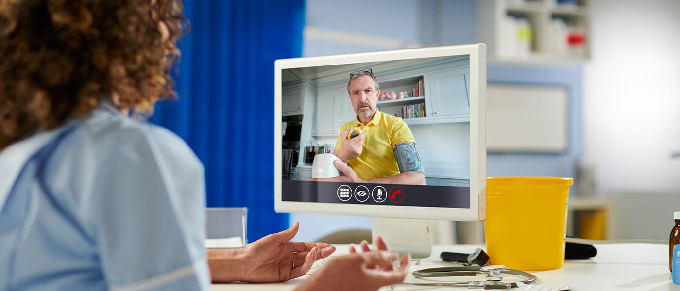 Man on telehealth call will Genesis Lifestyle Medicine doctor.