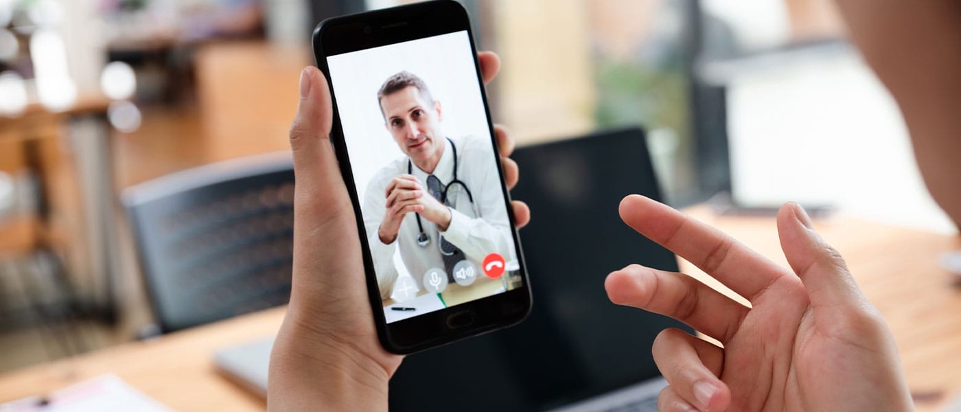 Patient on a telehealth call with doctor from Genesis Lifestyle Medicine.