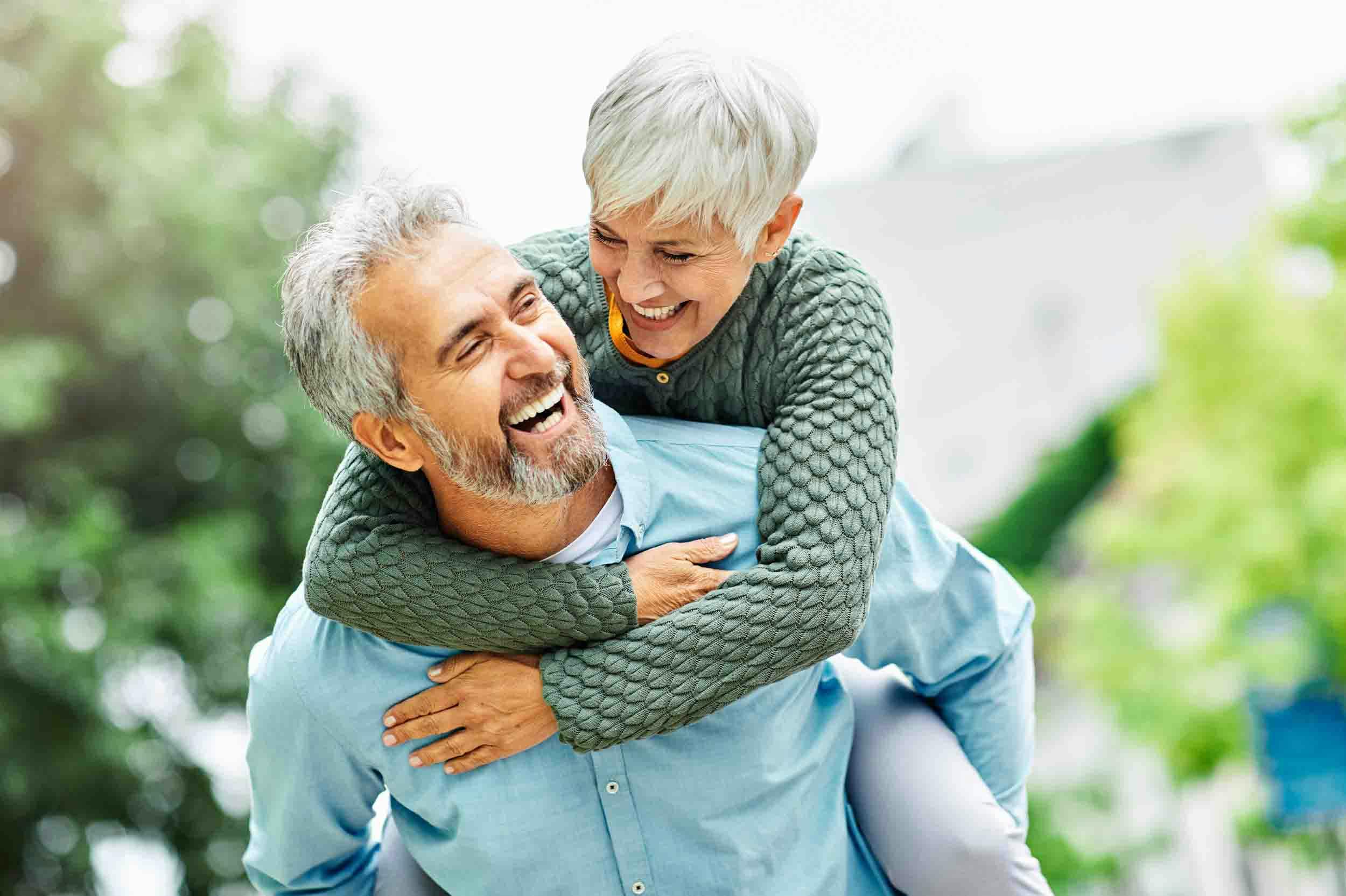 Happy laughing older couple after urinary incontinence treatments in Portland, TX