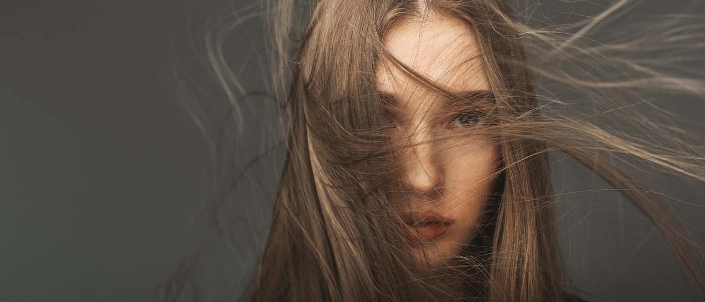 Woman with long hair indicating successful treatment with Semaglutide from Genesis Lifestyle Medicine.
