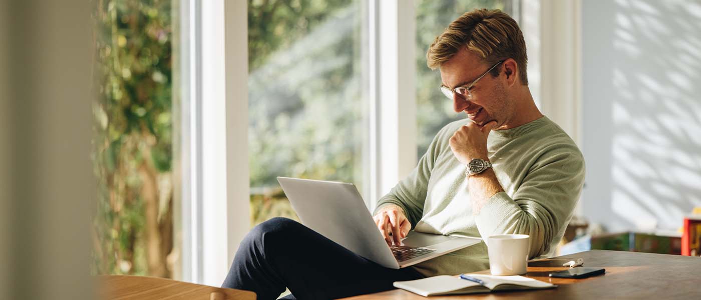 Man scheduling a consultation online at Genesis Lifestyle Medicine.