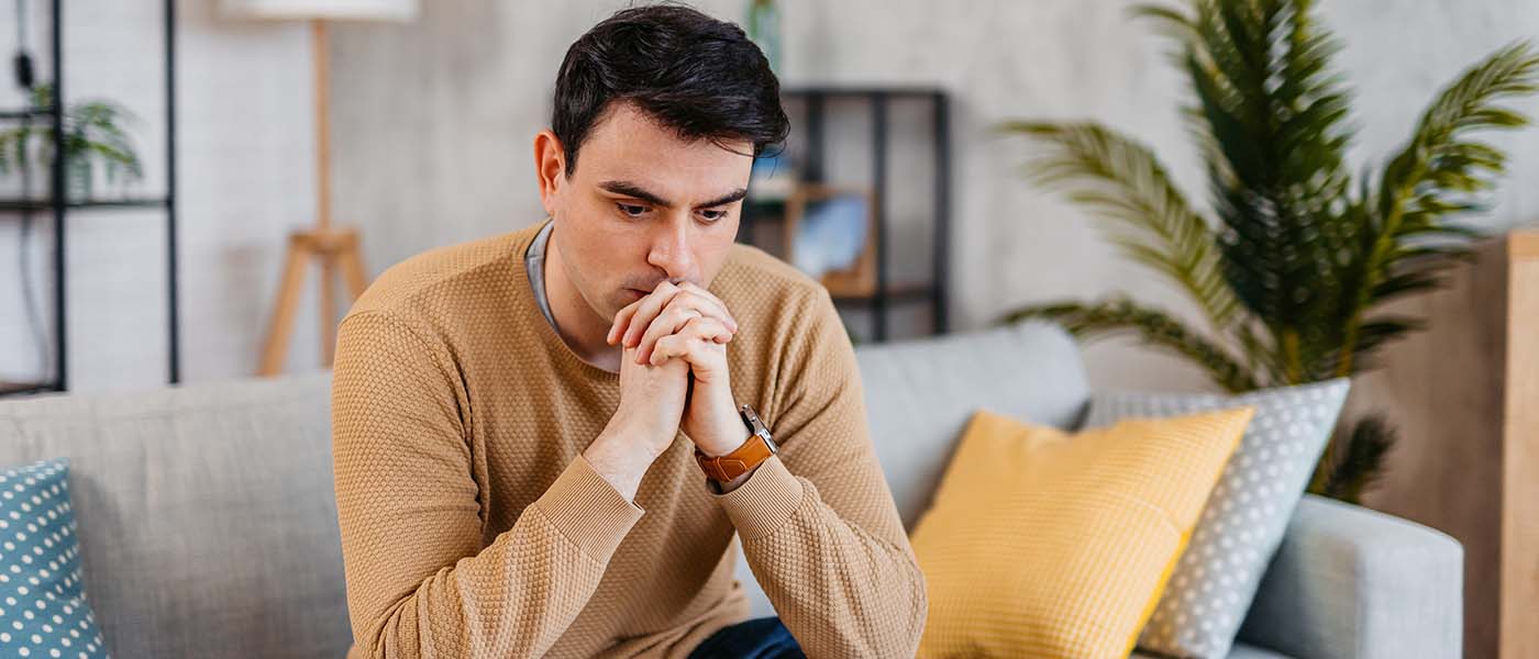 man considering ED treatment from Genesis Lifestyle Medicine.