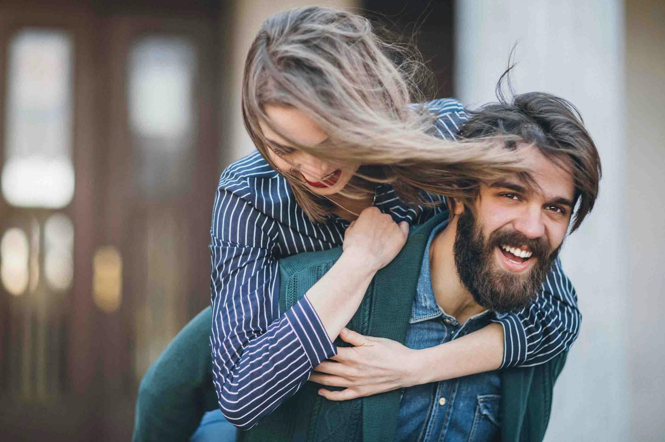 Happy couple with full, vibrant hair thanks to PRP hair restoration from Genesis Lifestyle Medicine.