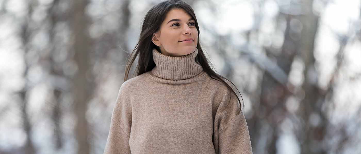 Woman with refreshed complexion post-microneedling treatment at Genesis Lifestyle Medicine.