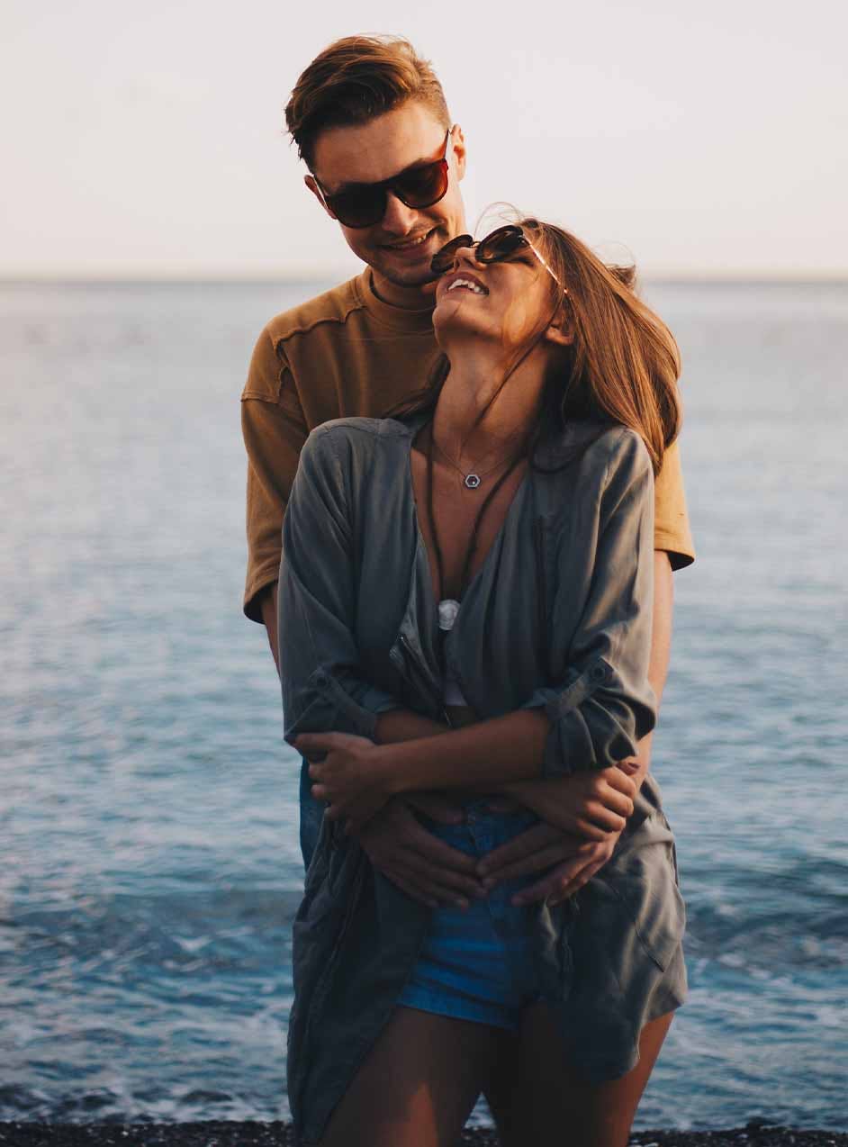 passionate couple on beach after erectile dysfunction treatment in Denver, CO